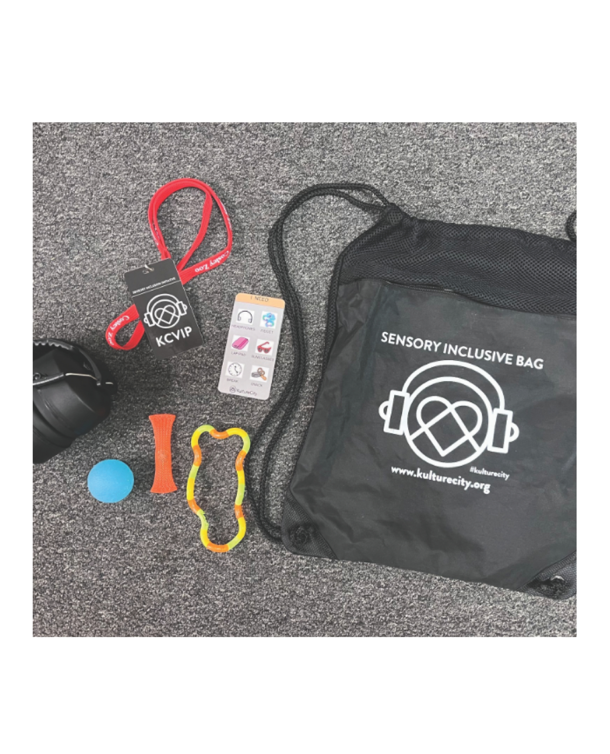 KultureCity sensory inclusive bag with headphones, fidget toys, and a KCVIP tag on a gray carpet.