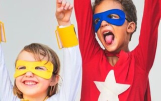 Children posing for Rvamped Fun Run To Feature Supercharged Superhero Racers