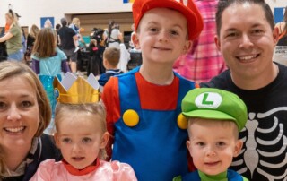 Family dressed in Halloween costumes