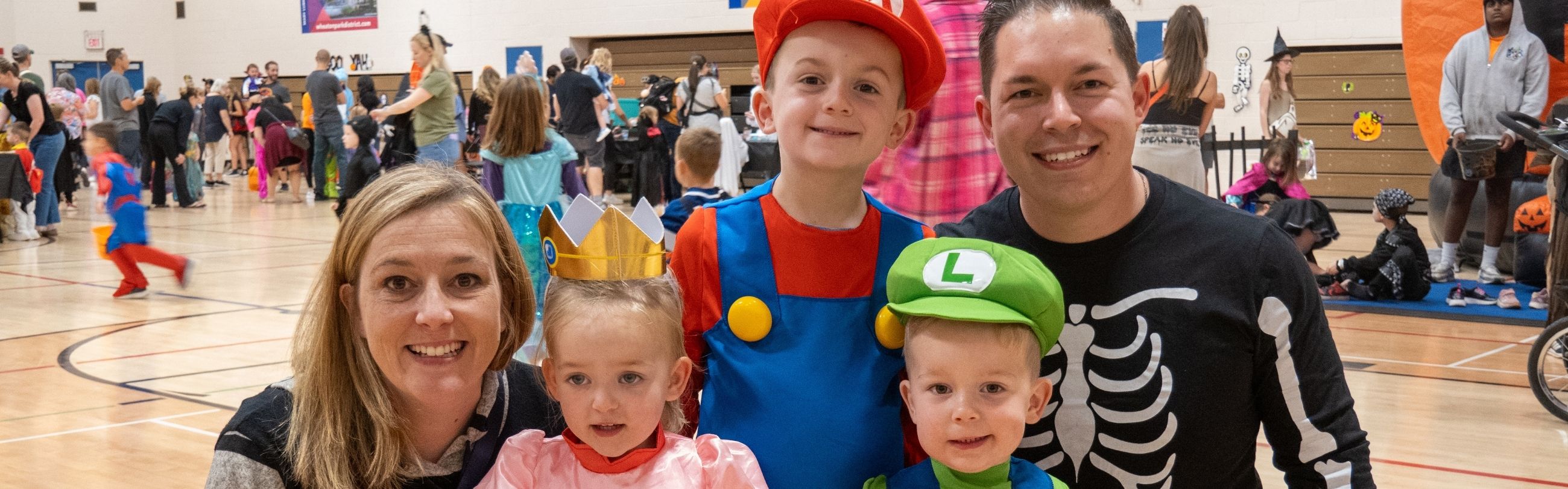 Family dressed in Halloween costumes