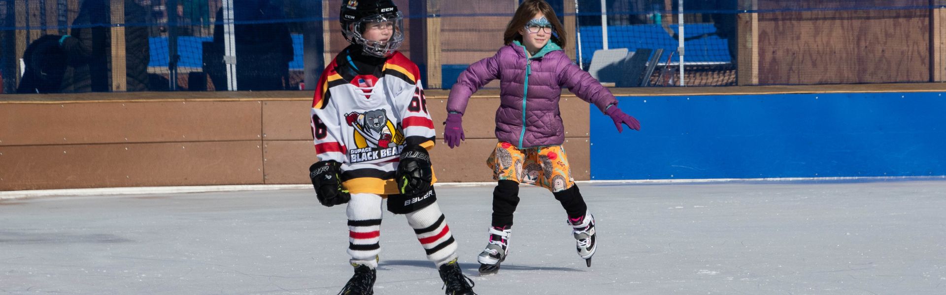 Photo of boy and girl ice skating at Ice-A-Palooza. Photo by Gerald Acabal.