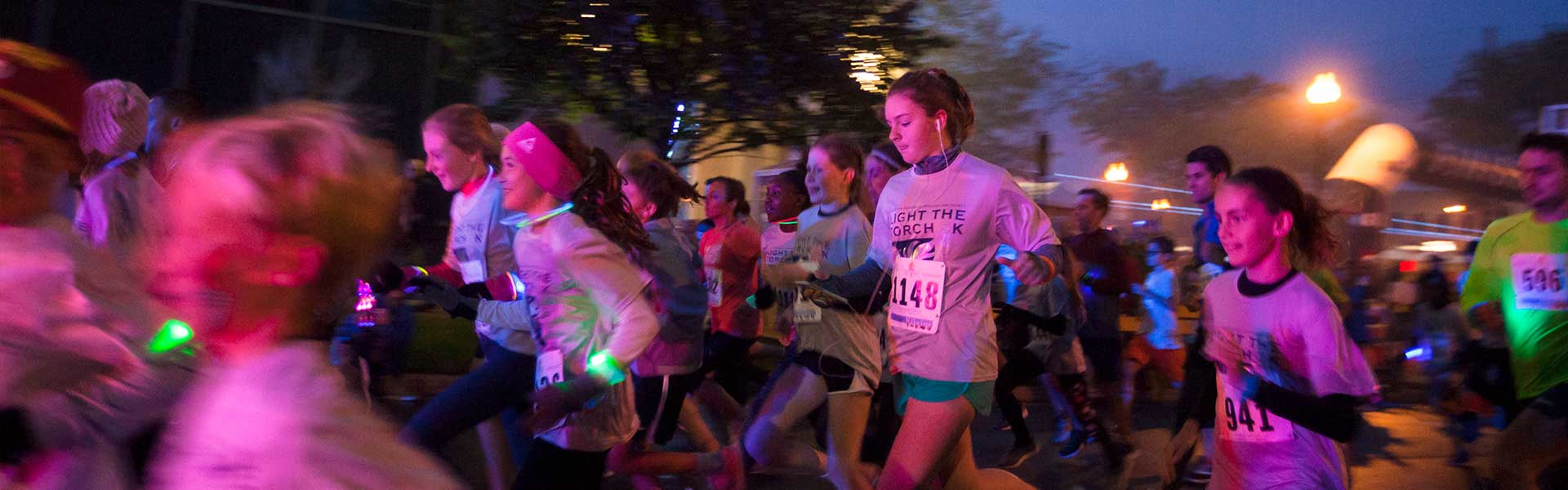 Photo of participants running at race event