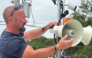 Park District Staff work on installing new Perry Weather system.