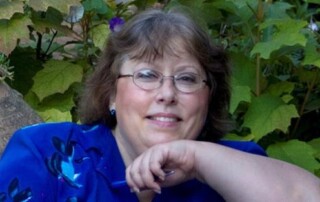 Author Cynthia Clampitt posing for a photo