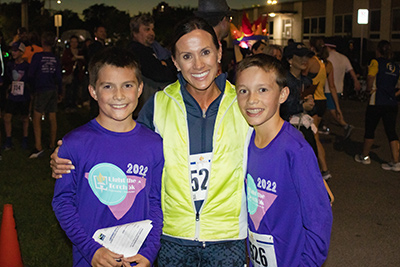 A mother and 2 kids in Light the Torch Run