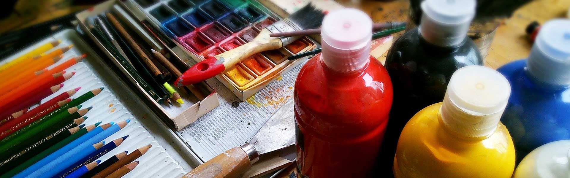 color pencils, paints and paint brush