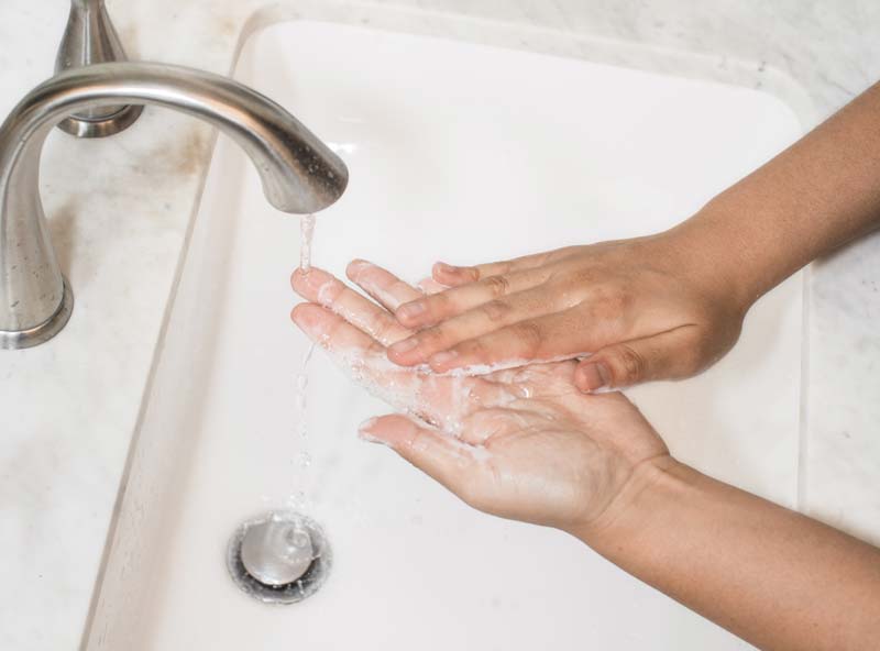 washing hands - photo by Curology on Unsplash